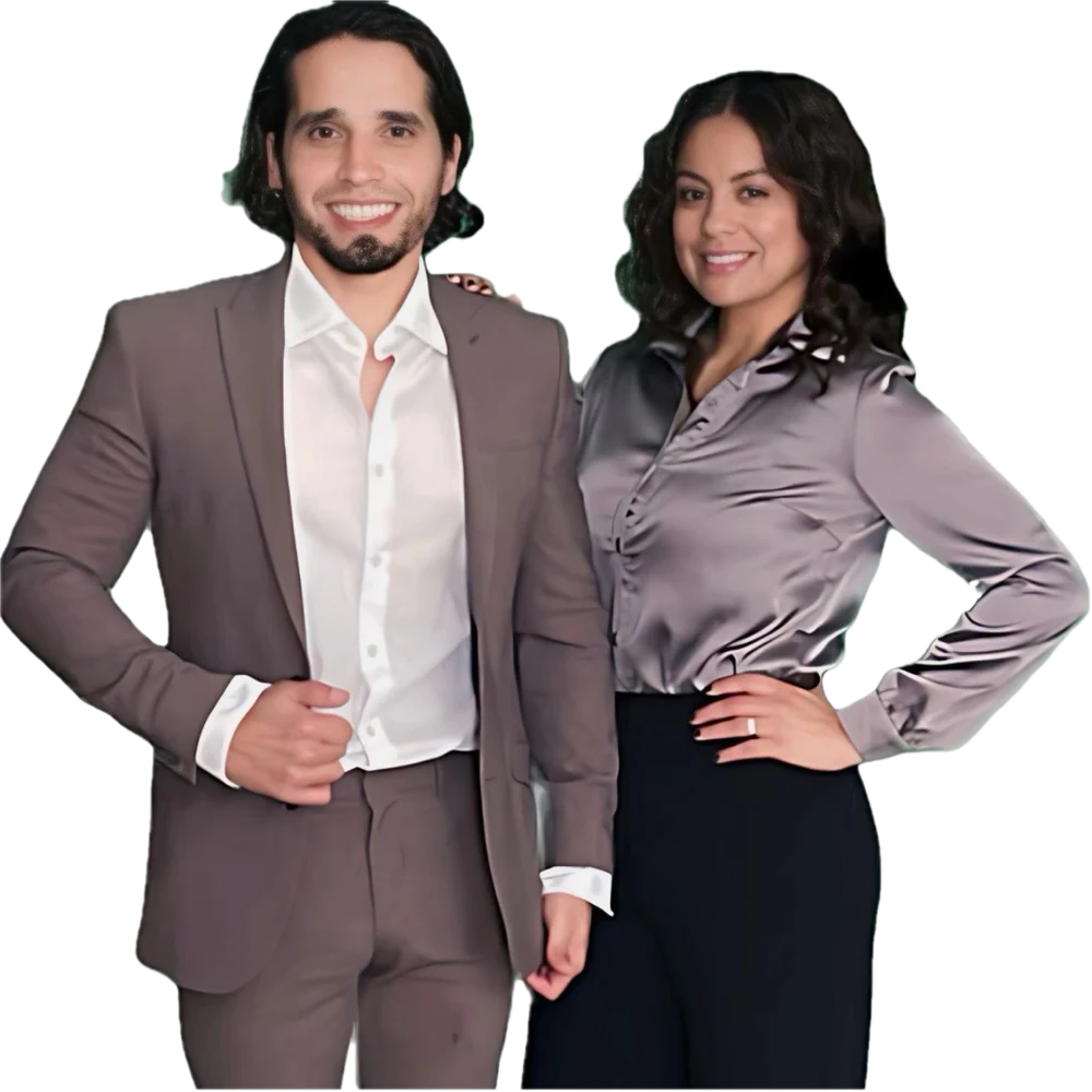 Sal and Desiree Torres of CREA Financial, smiling together in business attire